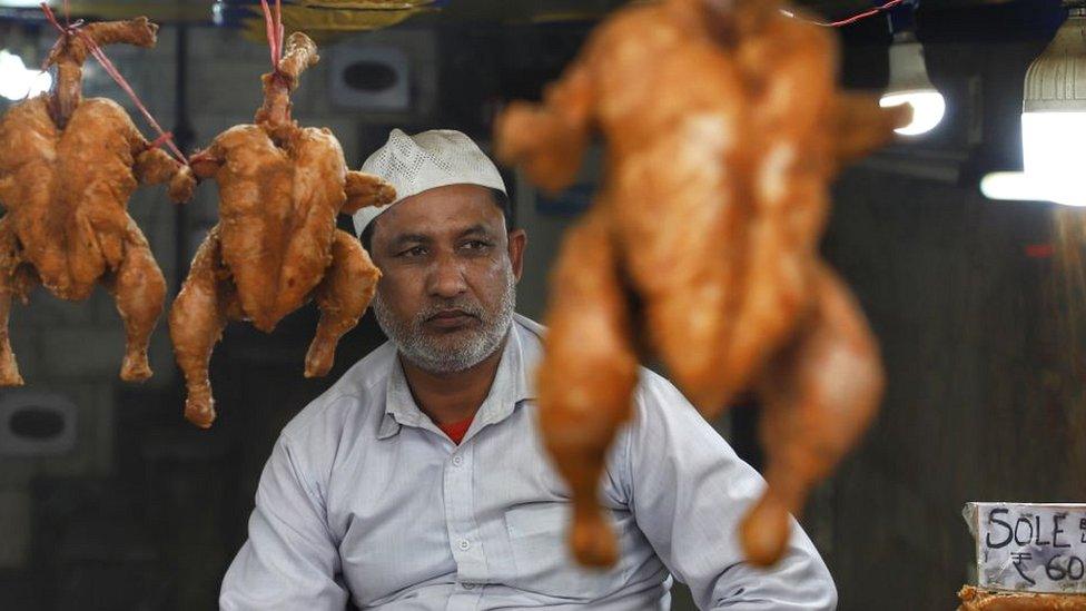 Chicken seller in Delhi market