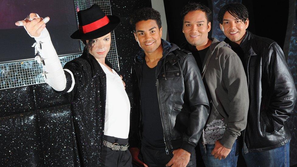 TJ Jackson, Taryll Jackson and Taj Jackson with a Michael Jackson waxwork