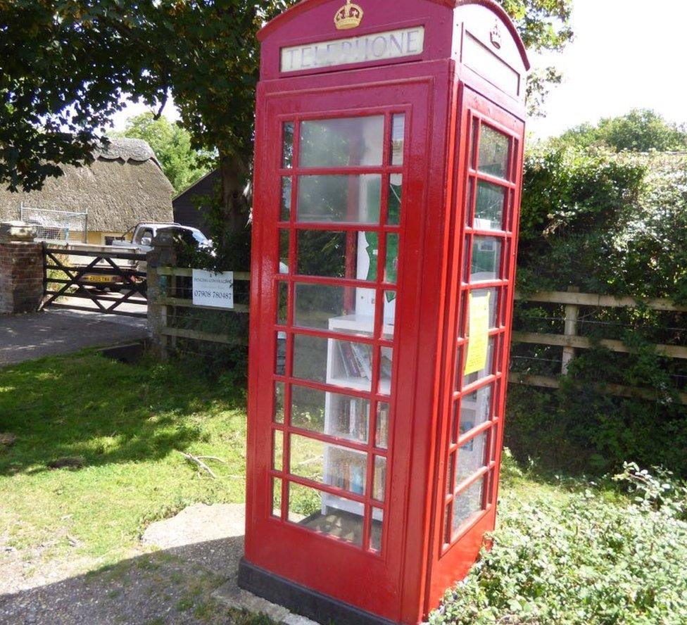 Phone box converted into a book exchange