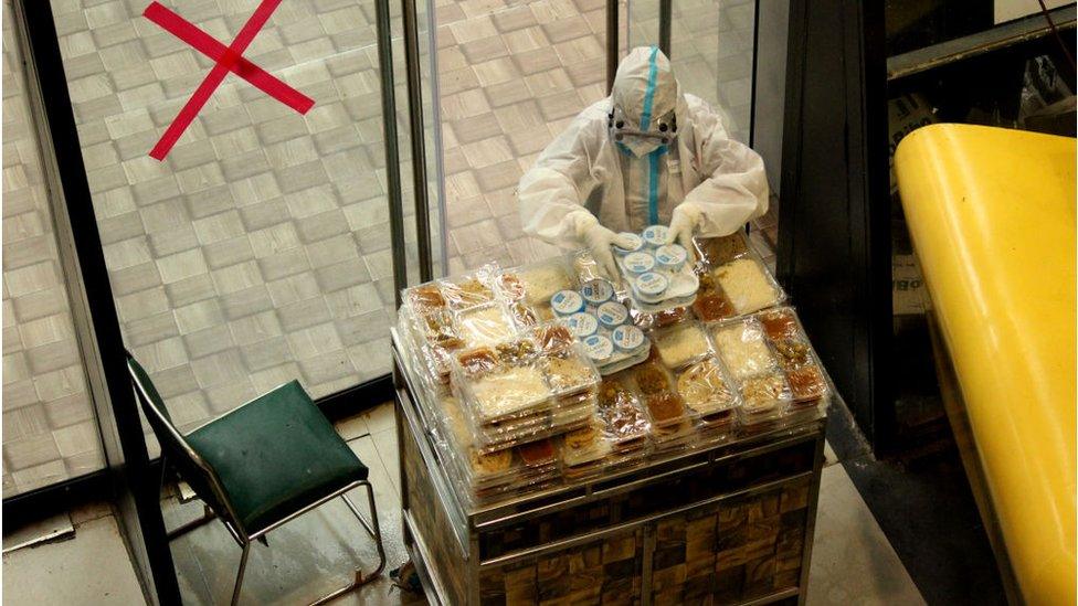 A ward boy with food trolley