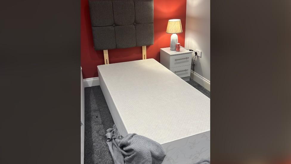 A bed with missing mattress.