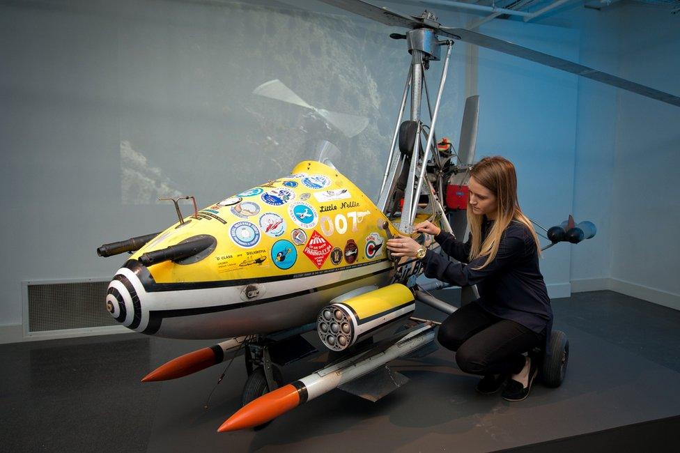 Little Nellie gyrocopter being fixed by a woman