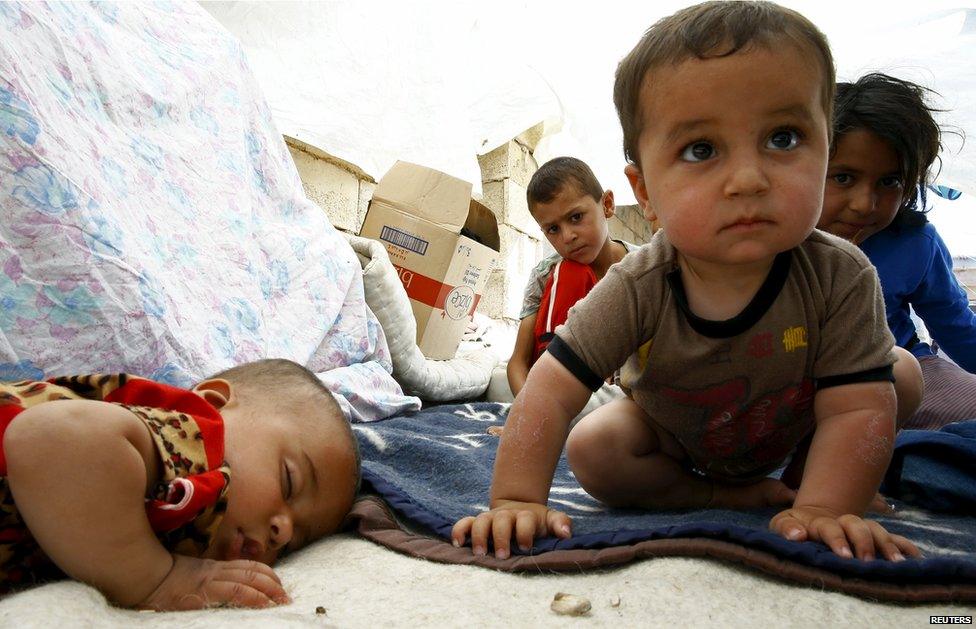 Syrian refugee children from the northern Syrian town of Tel Abyad sit under a make shift tent in Akcakale, in Sanliurfa province, Turkey, 18 June 2015