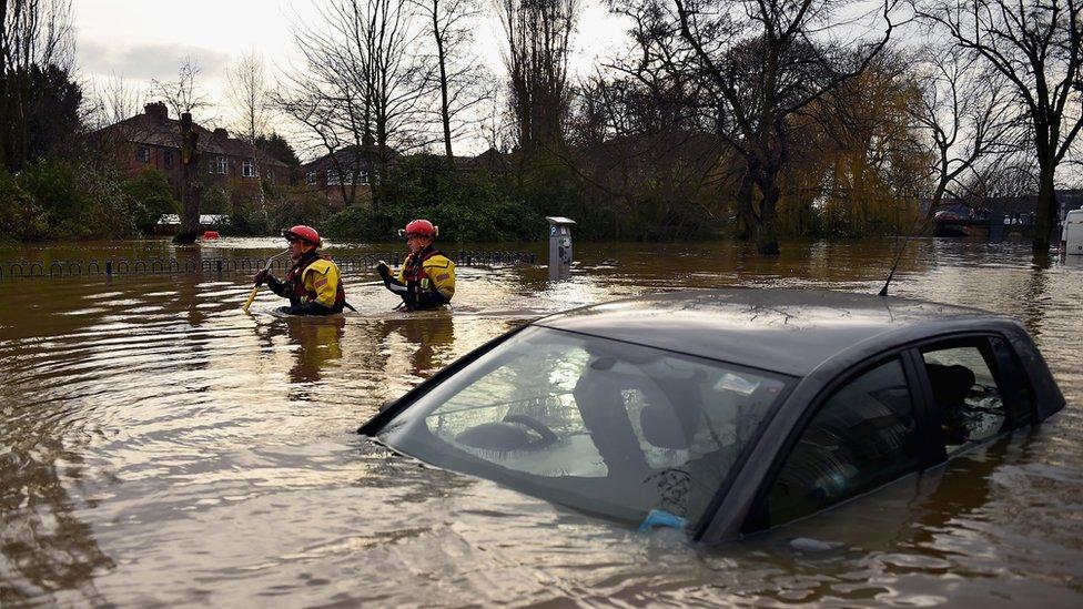 Car overwhelmed by flooding