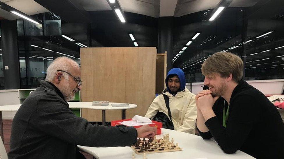 Ali and Patrick enjoying a late afternoon game at the library's chess club