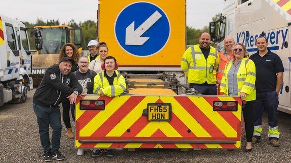 Dominic and members of National Highways by an impact protection vehicle