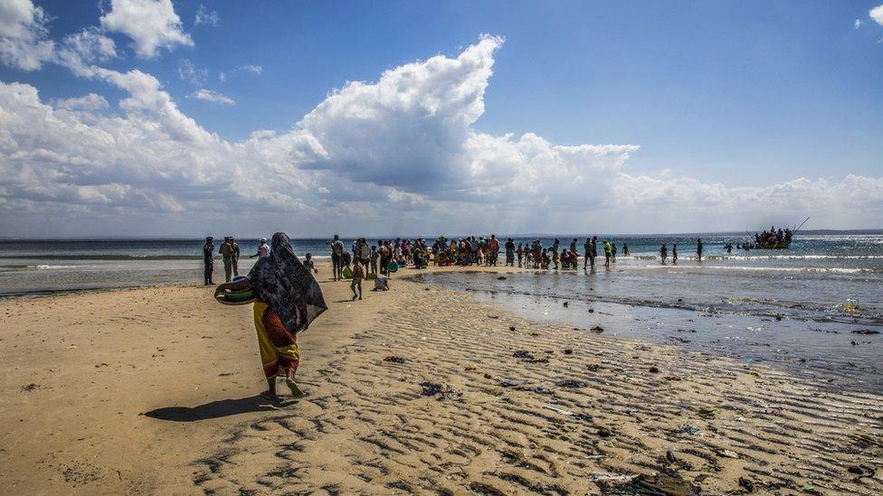 File photo of people fleeing on a beach in northern Mozambique