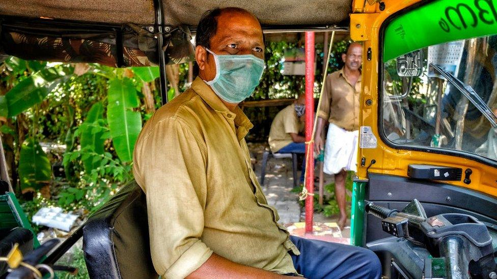 Tuk-tuk driver wearing mask