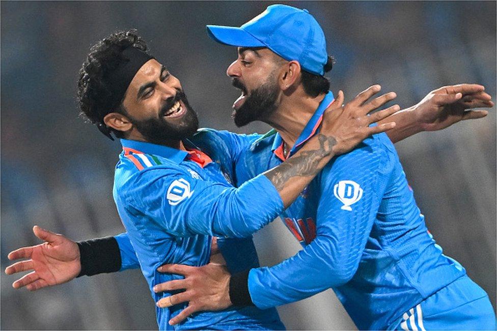 India's Ravindra Jadeja (L) celebrates with Virat Kohli after taking the wicket of South Africa's captain Temba Bavuma during the 2023 ICC Men's Cricket World Cup one-day international (ODI) match between India and South Africa at the Eden Gardens in Kolkata on November 5, 2023.