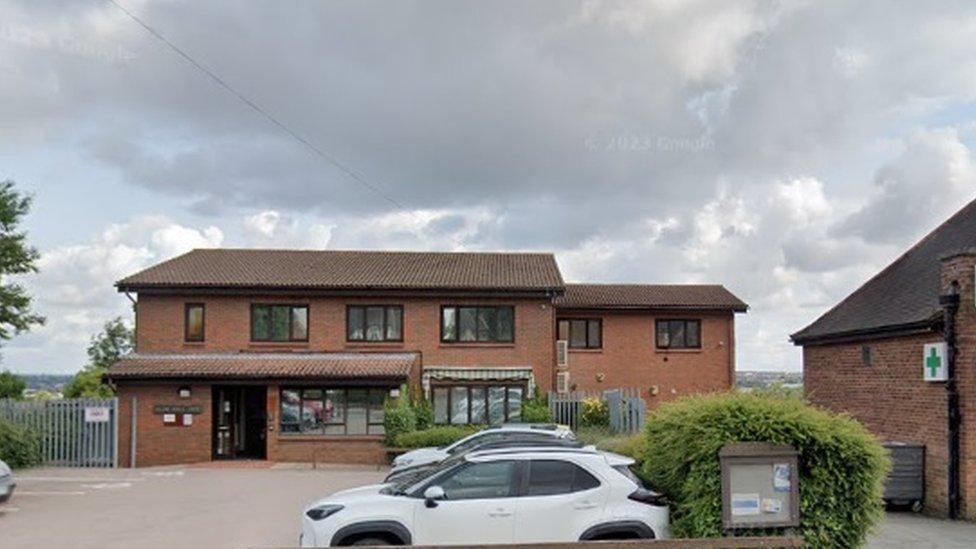 Brick-built, two-storey surgery in a residential street