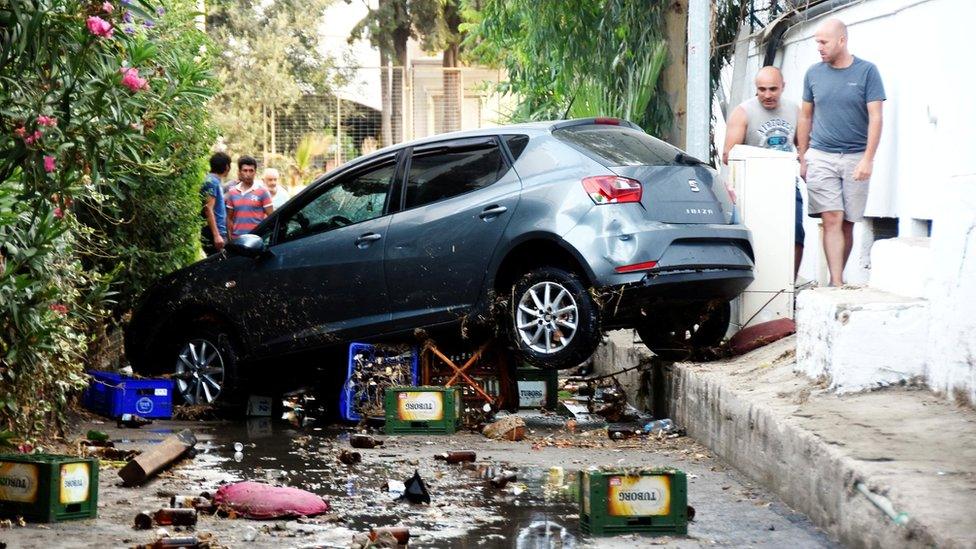 A car is seen after an earthquake and a tsunami in the resort town of Gumbet in Mugla province, Turkey, 21 July 2017