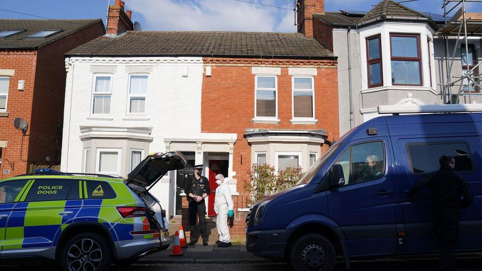 Police and forensics outside a house on Moore Street, Northampton