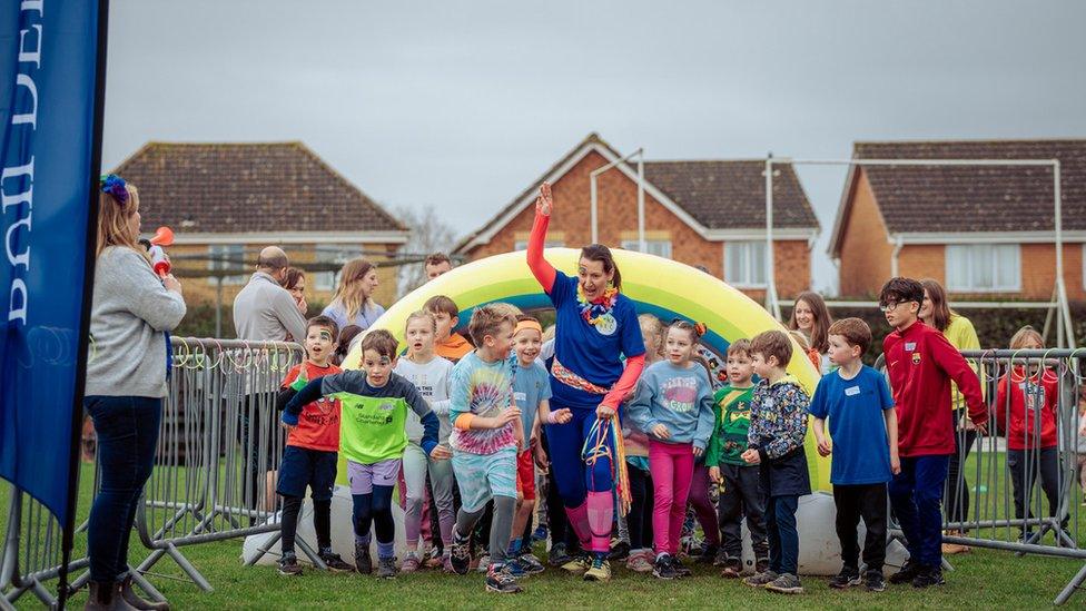 Emma and children taking part in the challenge