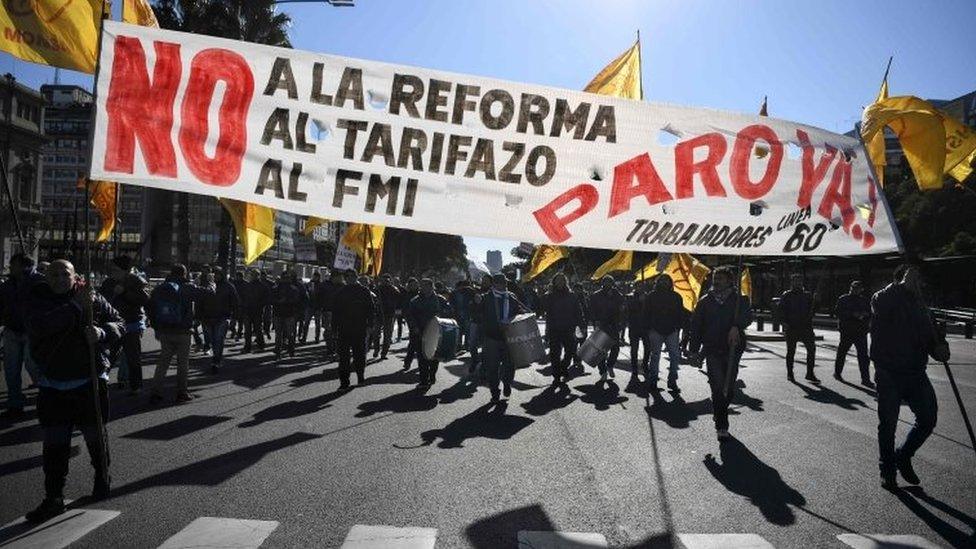 Demonstrators march along 9 de Julio avenue in Buenos Aires on June 25, 2018, during a 24-hour general strike called by Argentina's unions in protest of the government's deal with the International Monetary Fund.