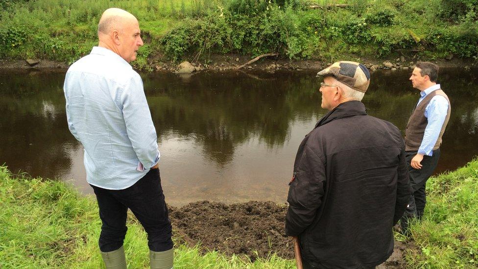 Barney Devine. Maurice Owens and Paul Logue at the place where the sword was found