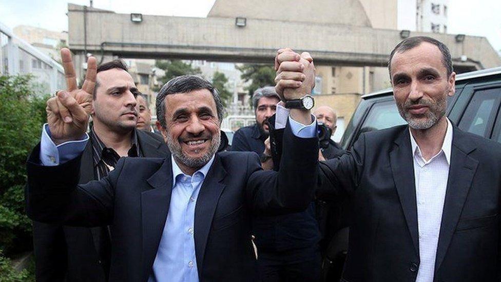 Mahmoud Ahmadinejad holds hands with former vice-president, Hamid Baghaei (12 April 2017)