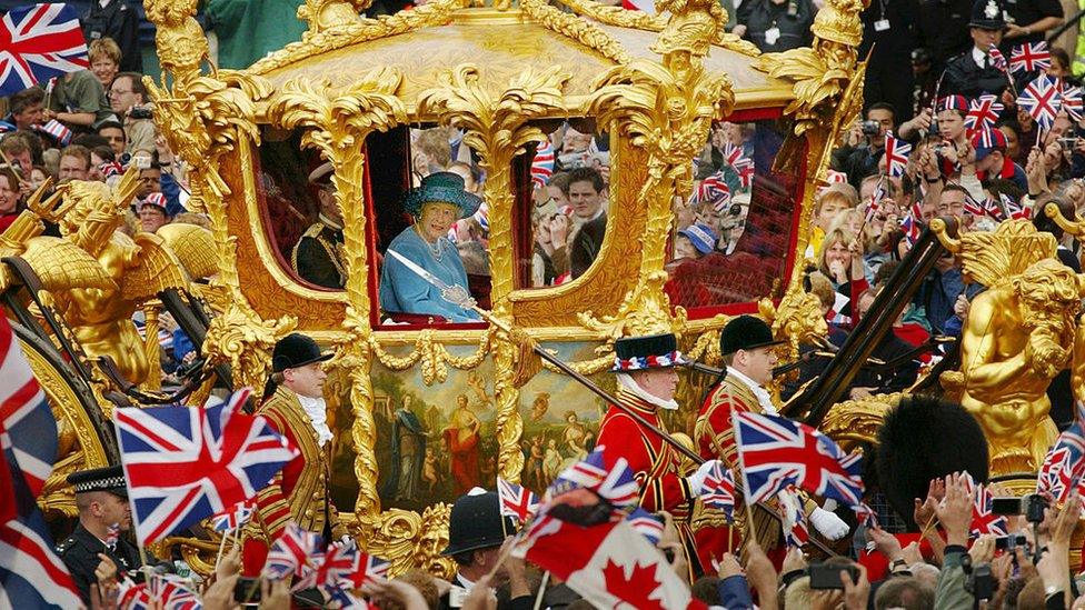 Queen Elizabeth and Prince Philip ride in the Golden State Carriage at the head of a parade from Buckingham Palace to St Paul's Cathedral celebrating the Queen's Golden Jubilee June 4, 2002