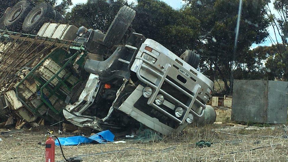 An upside down lorry carrying beehives in Australia