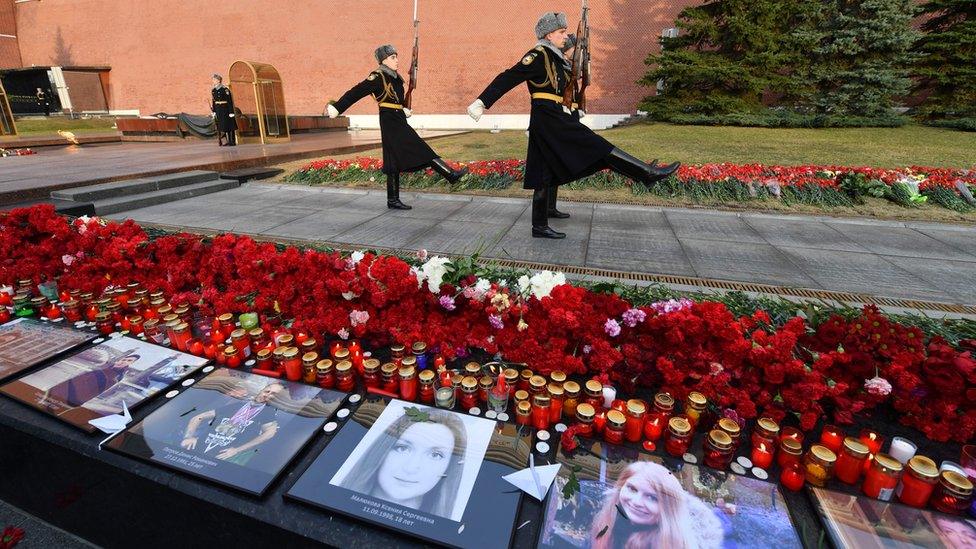 Portraits of the victims were laid out in Moscow as a tribute