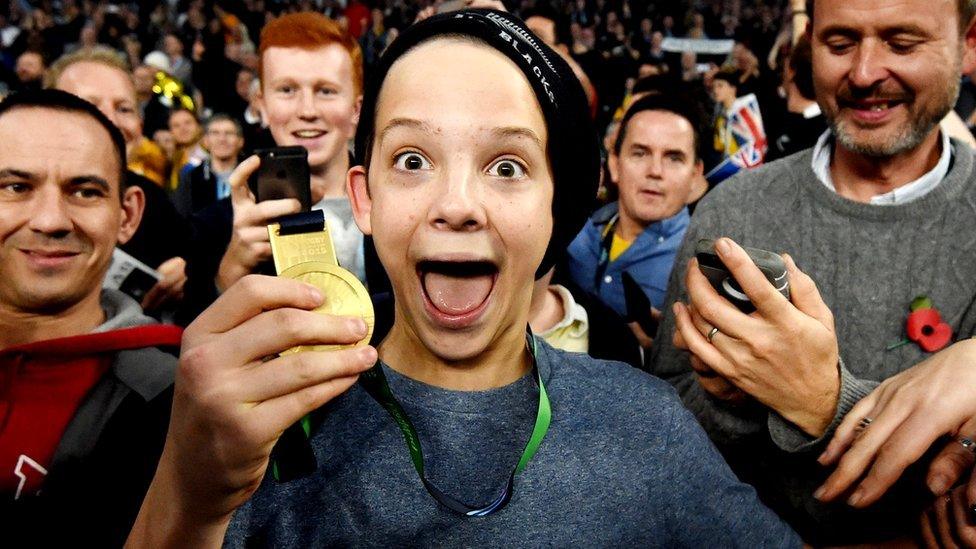 Charlie shows off his medal