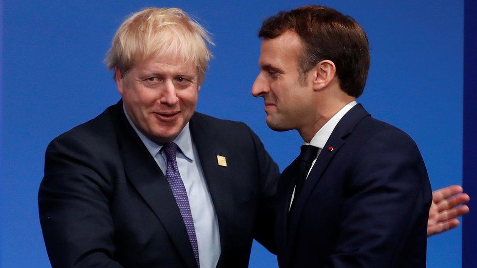 Britain"s Prime Minister Boris Johnson welcomes France"s President Emmanuel Macron at the NATO leaders summit in Watford,