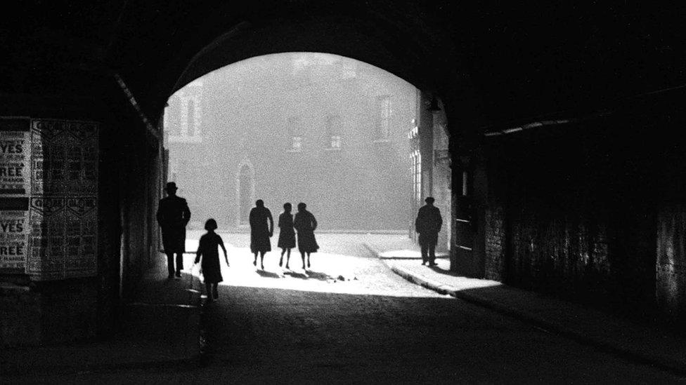 Figures in a tunnel, East End of London, 1949