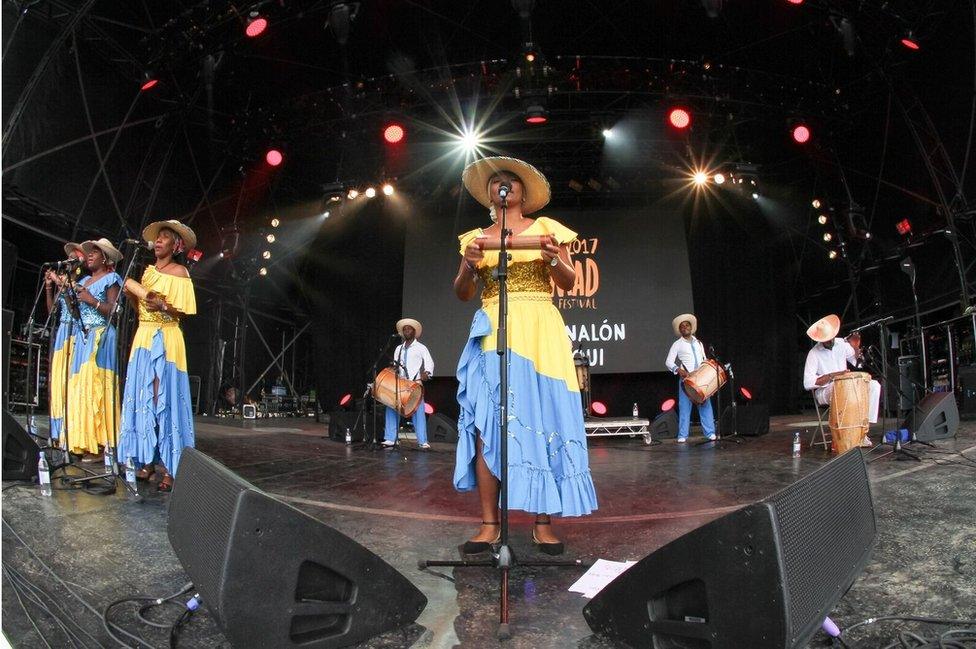 Nidia Gongora fronts the five female singers backed by all manner of percussion.