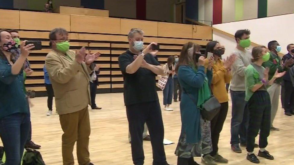 Green Party supporters and councillors applauding results