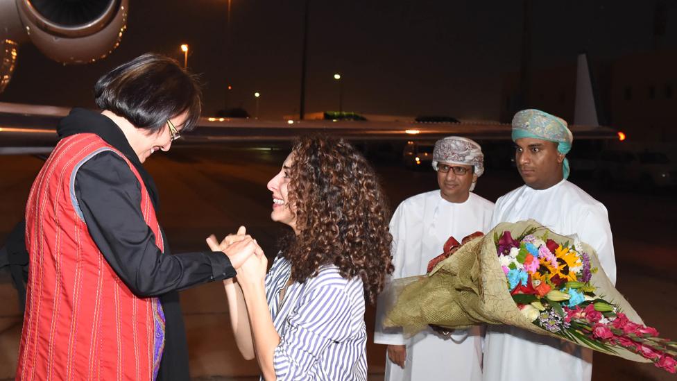 This photo made available by Oman News Agency, shows retired Iranian-Canadian professor Homa Hoodfar arriving in Muscat airport, Oman