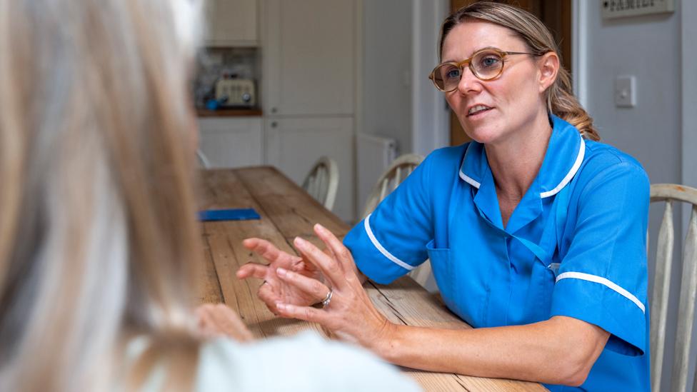 A nurse in a person's home