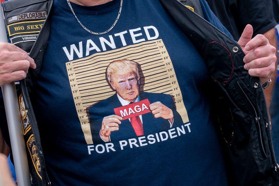  A demonstrator stands outside the E. Barrett Prettyman US Courthouse in Washington, DC, on August 3, 2023, ahead of the arraignment of former US President Donald Trump