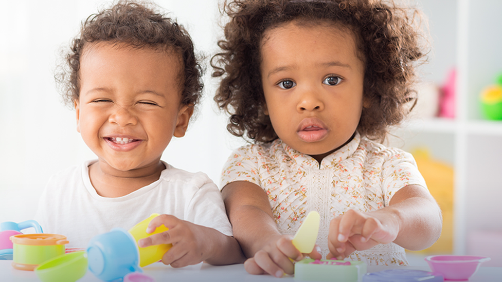 Toddlers playing with toys