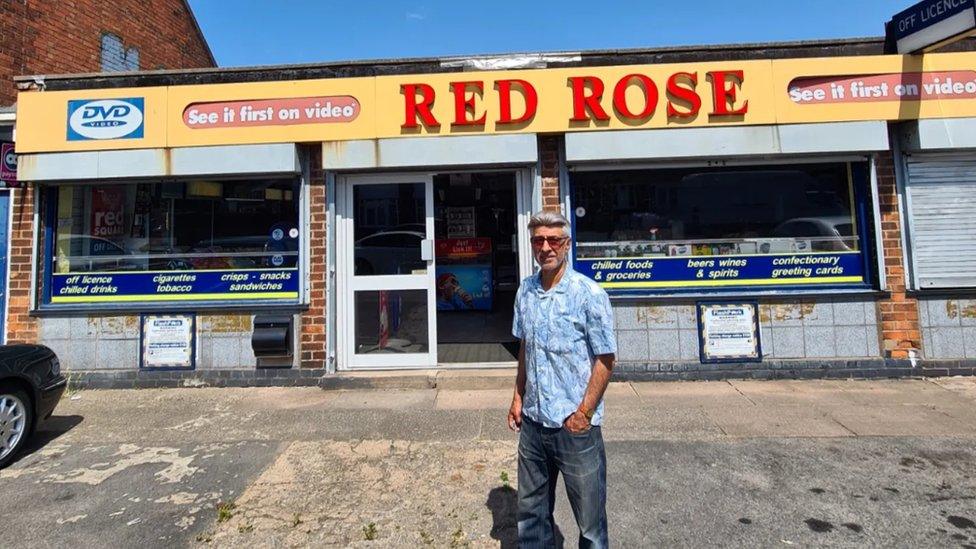 Sunil Dattani in front of his Red Rose shop which he opened in 1981