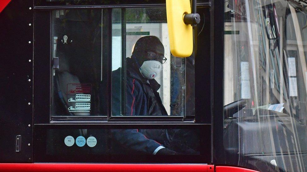 Bus driver with face mask