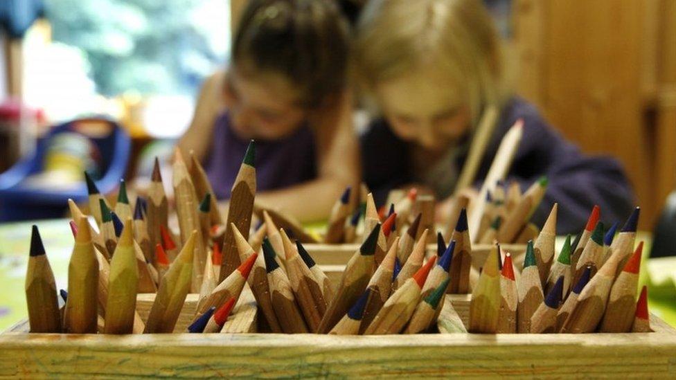 Children concentrating in a nursery