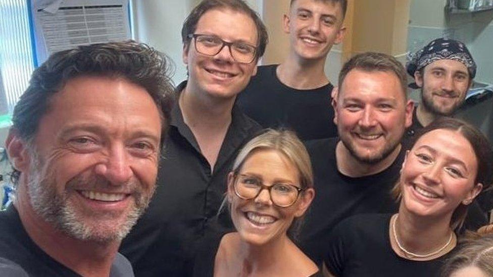 Hugh Jackman with restaurant staff