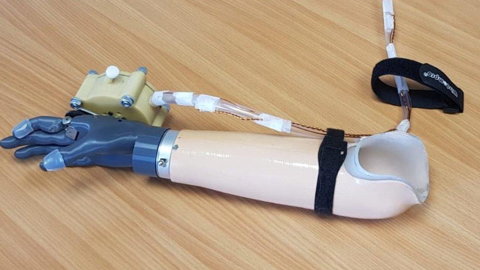 Breath powered prosthetic hand