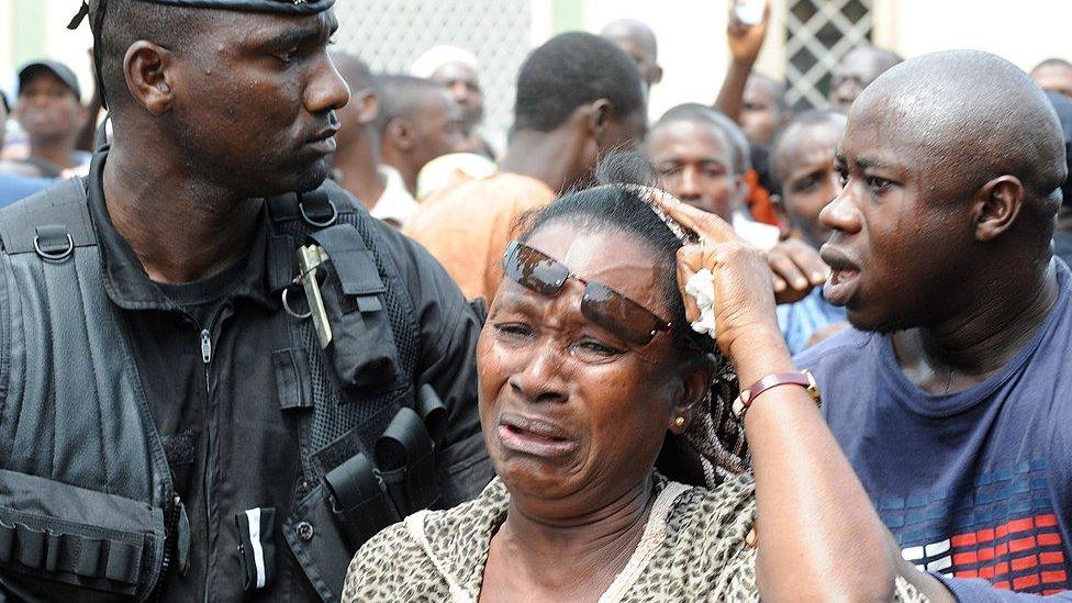 A woman in tear in Conakry following the stadium massacre in 2009, Guinea