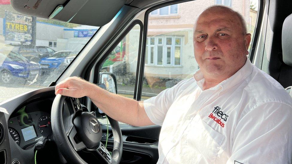 Mike Morgan in the driving seat of the bus