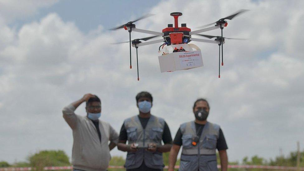 Technicians fly a drone belonging to the Throttle Aerospace Systems (TAS) to deliver life saving medical supplies during a flight testing