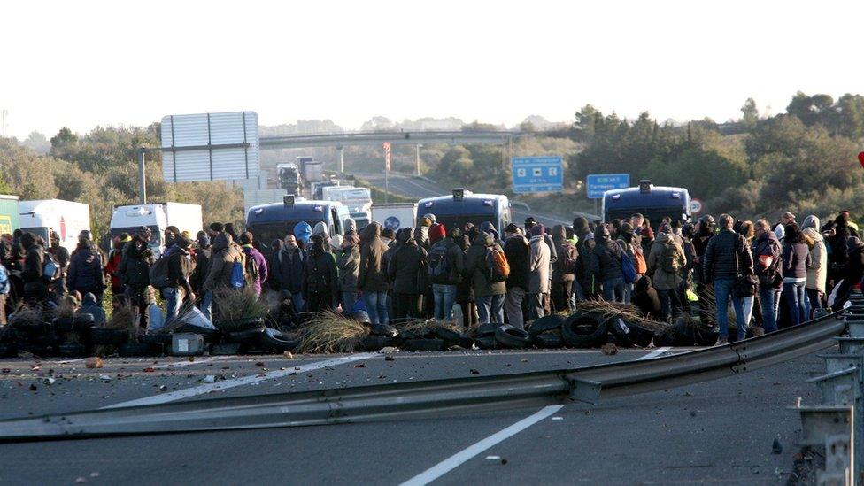 Pro-independence supporters block a section of the AP7 motorway in Tarragona, north-eastern Spain, 21 December 2018