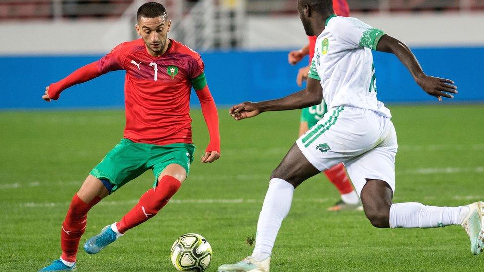 Hakim Ziyech of Morocco (in red)