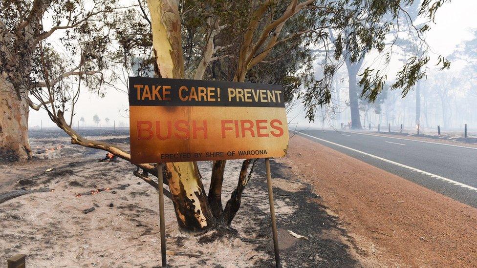 A sign damaged by fire near Waroona in Western Australia