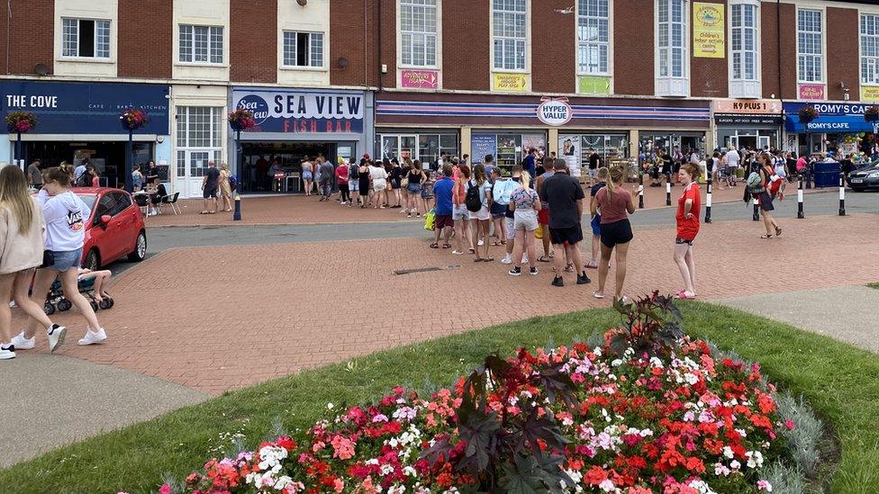 Socially distanced fish and chips queue