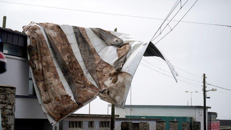 The scene in Youghal, Co Cork, where a roof has been blown from a building