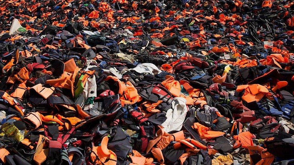 Thousands of discarded life vests in the hills above Mithymna, Greece, in 2016