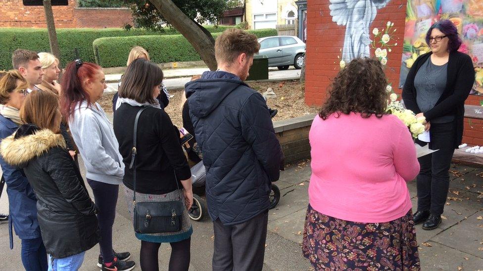 People gathered at a bench