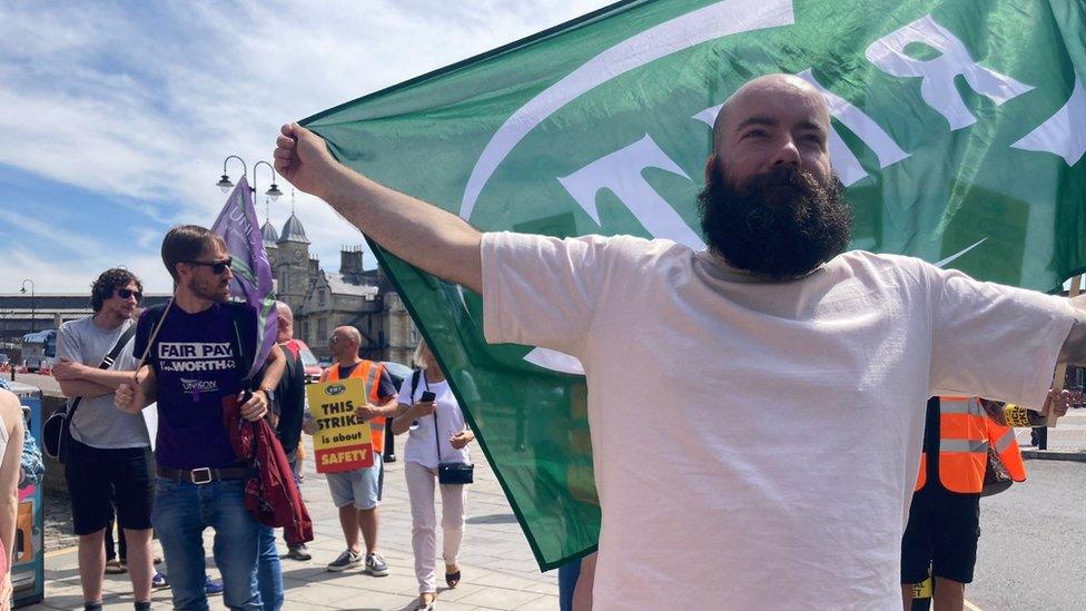 Man holding RMT flag