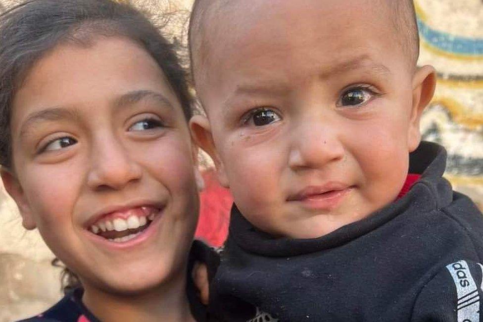 Alma (L) and Tarazan, her 18-month-old brother who was killed in a reported Israeli air strike in Gaza City in December 2023