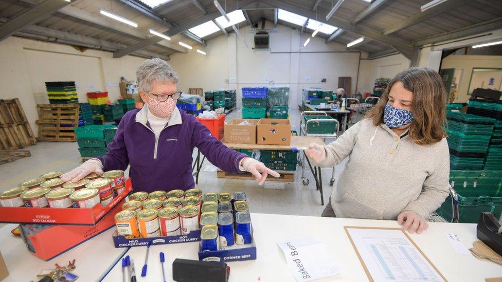 Volunteers at a food bank sorting hub in Weymouth